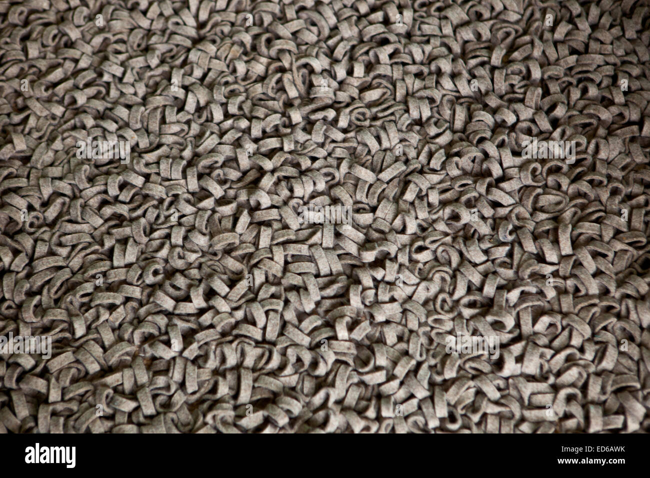 Fragment eines curly Teppich-Materials auf braune Farbe Stockfoto