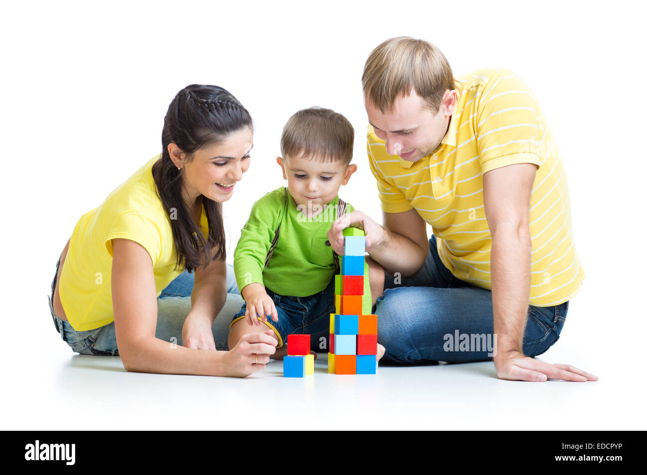 Kind mit seinen Eltern spielen Bausteine Stockfoto