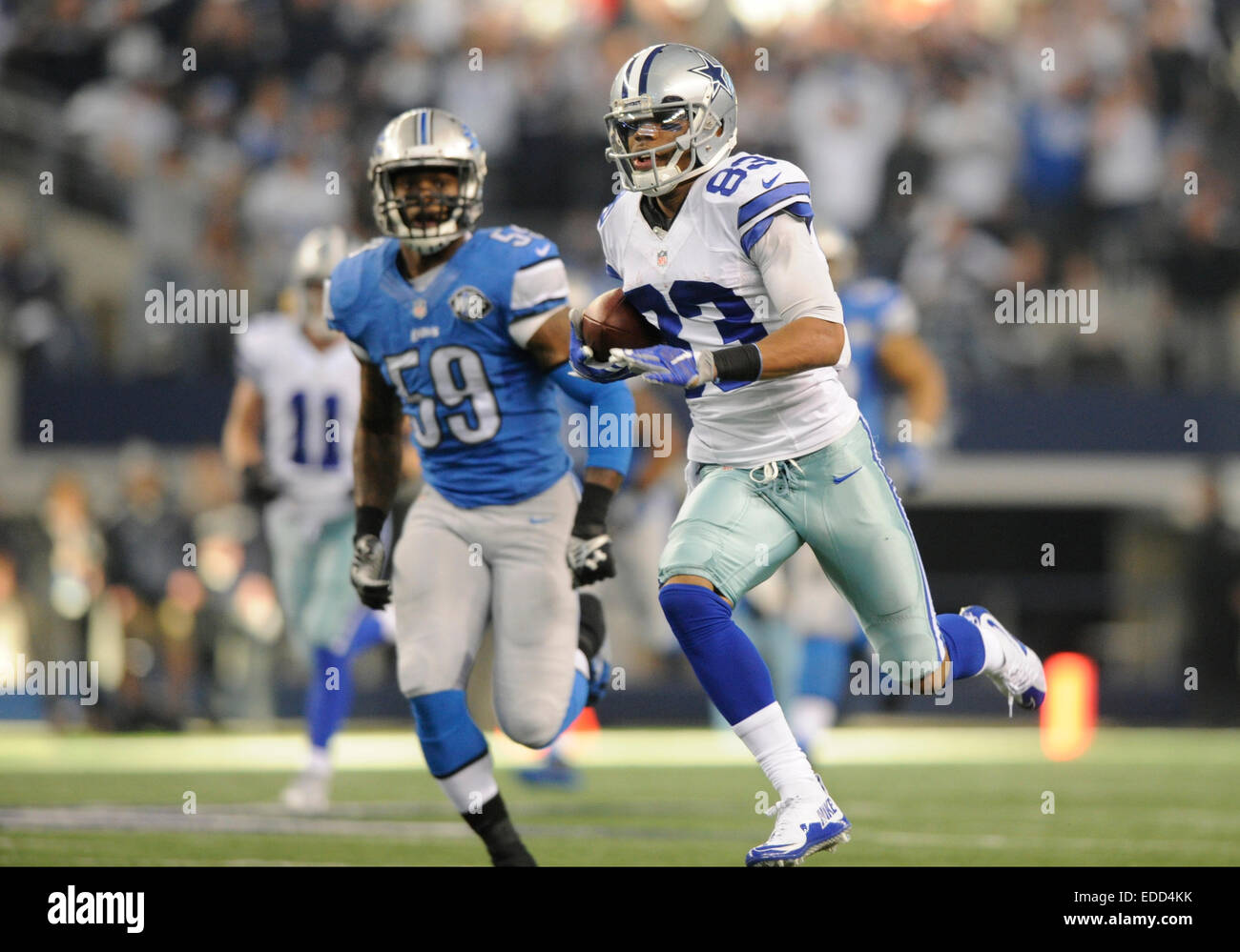 January 04, 2015: Dallas Cowboys outside linebacker Dekoda Watson #56 and Detroit  Lions defensive tackle Andre Fluellen #96 exchange jerseys after an NFL  Wild Card Playoff football game between the Detroit Lions