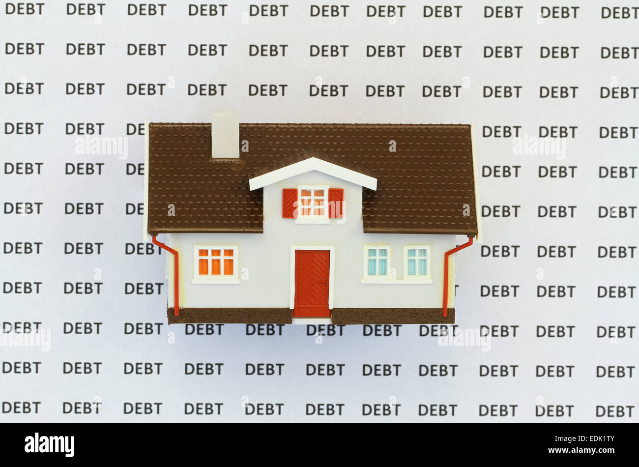 Haus am Hintergrund mit Worten Schulden Stockfoto