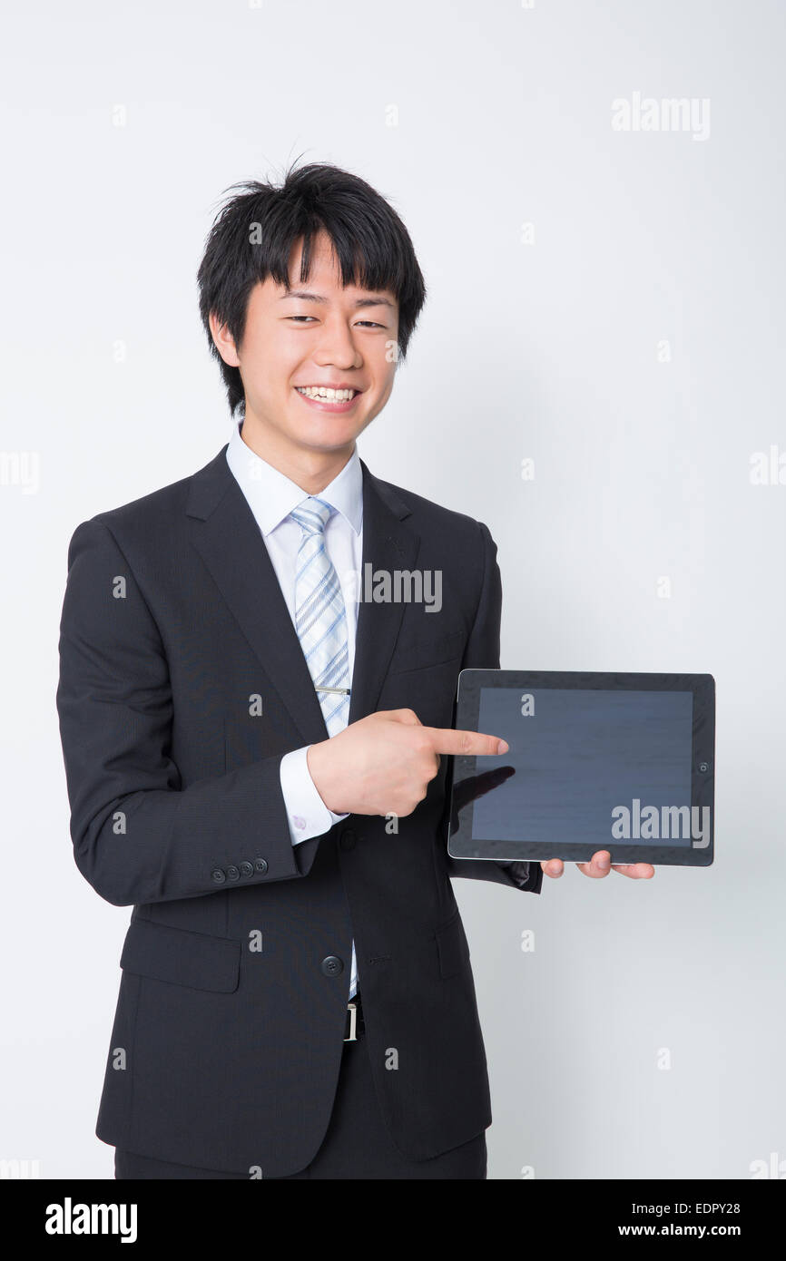 Businessman Pointing at Tablet-Computer Stockfoto