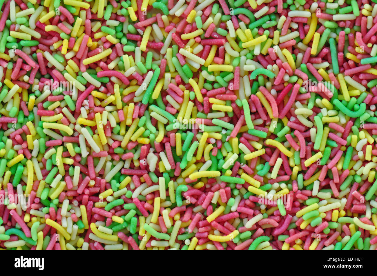 Bunte Streusel garnieren Süßigkeiten Richtfest abstrakten Hintergrund. Stockfoto