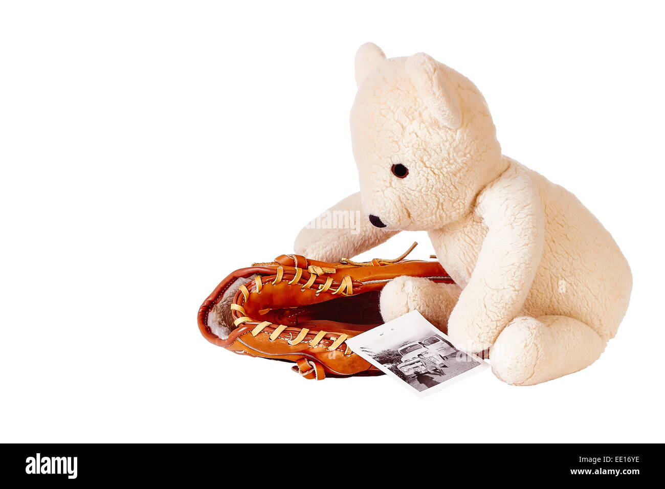Teddybär mit Baseball-Handschuh und altes Foto Stockfoto