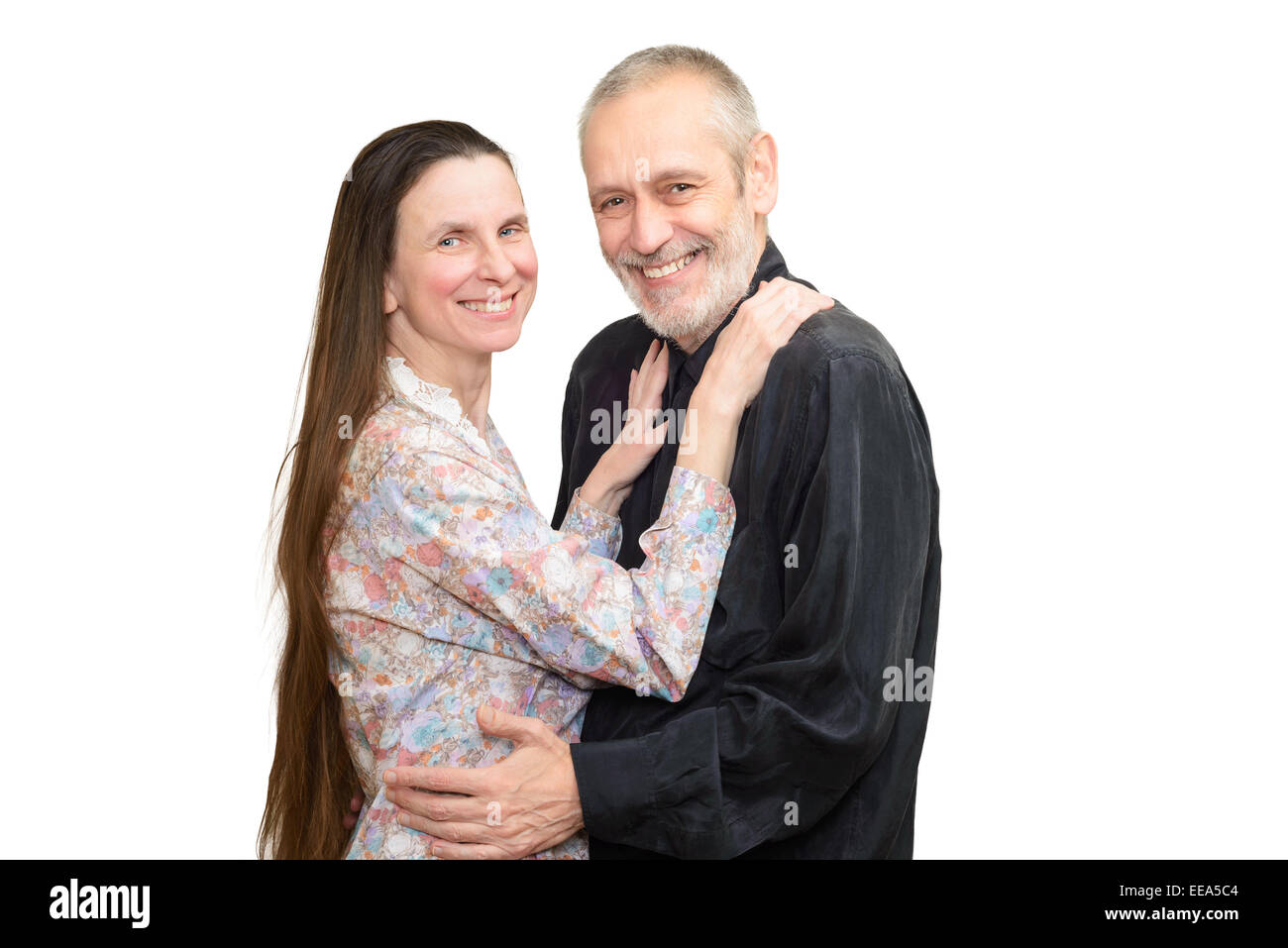 Glücklich reifer Mann und Frau mit langem Haar Lächeln für S. Valentin Tag oder ein Jubiläum. Isoliert auf weißem Hintergrund. Stockfoto