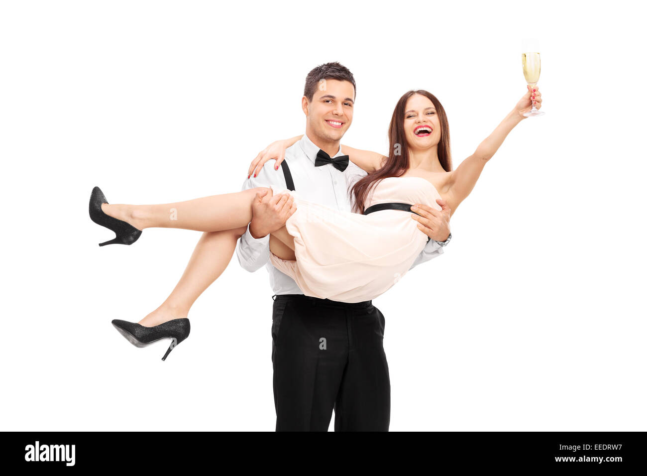 Junges Paar trinken Champagner und Spaß isoliert auf weißem Hintergrund Stockfoto