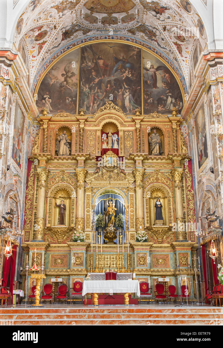 Sevilla, Spanien - 29. Oktober 2014: Der Hauptaltar der barocken Kirche Basilica del Maria Auxiliadora. Stockfoto