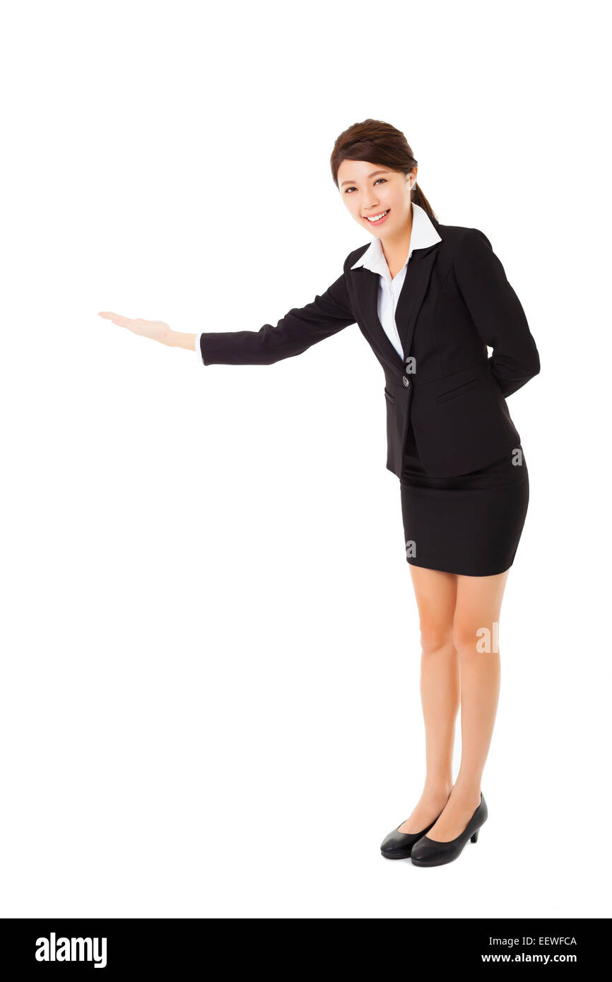 asiatische Geschäftsfrau mit ihrem Arm in eine einladende Geste Stockfoto