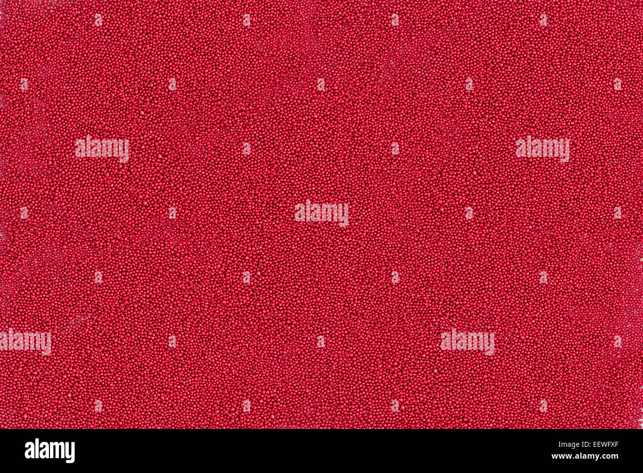 Hintergrund der winzige rote metallische Kugeln Stockfoto