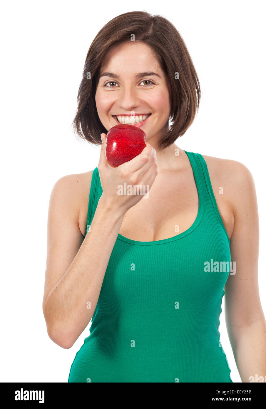 Schöne junge Brünette Essen einen roten Apfel, isoliert auf weiss Stockfoto