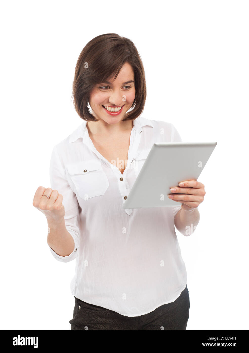 Glückliche Frau über ein Touchpad, isoliert auf weiss Stockfoto