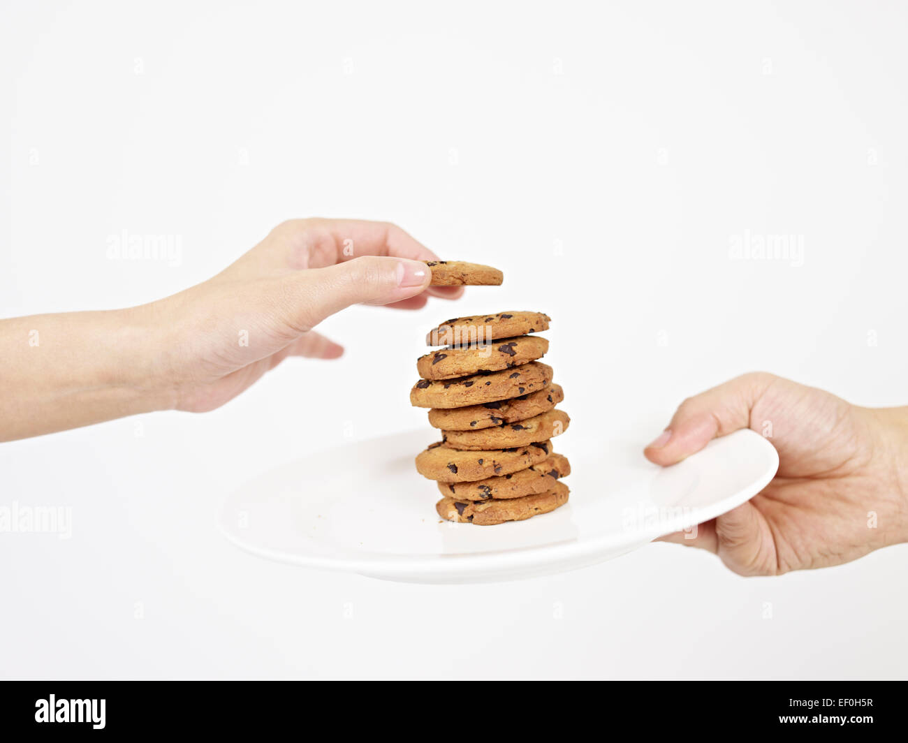 Hand, die Abholung cookie Stockfoto