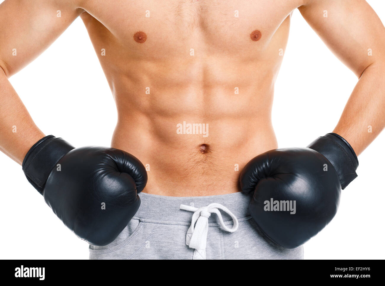 Sportlich attraktive Mann tragen Boxhandschuhe auf dem weißen Hintergrund Stockfoto