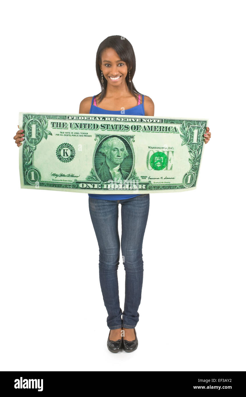 Schlanke Frau hinter übergroßen Dollarschein Stockfoto