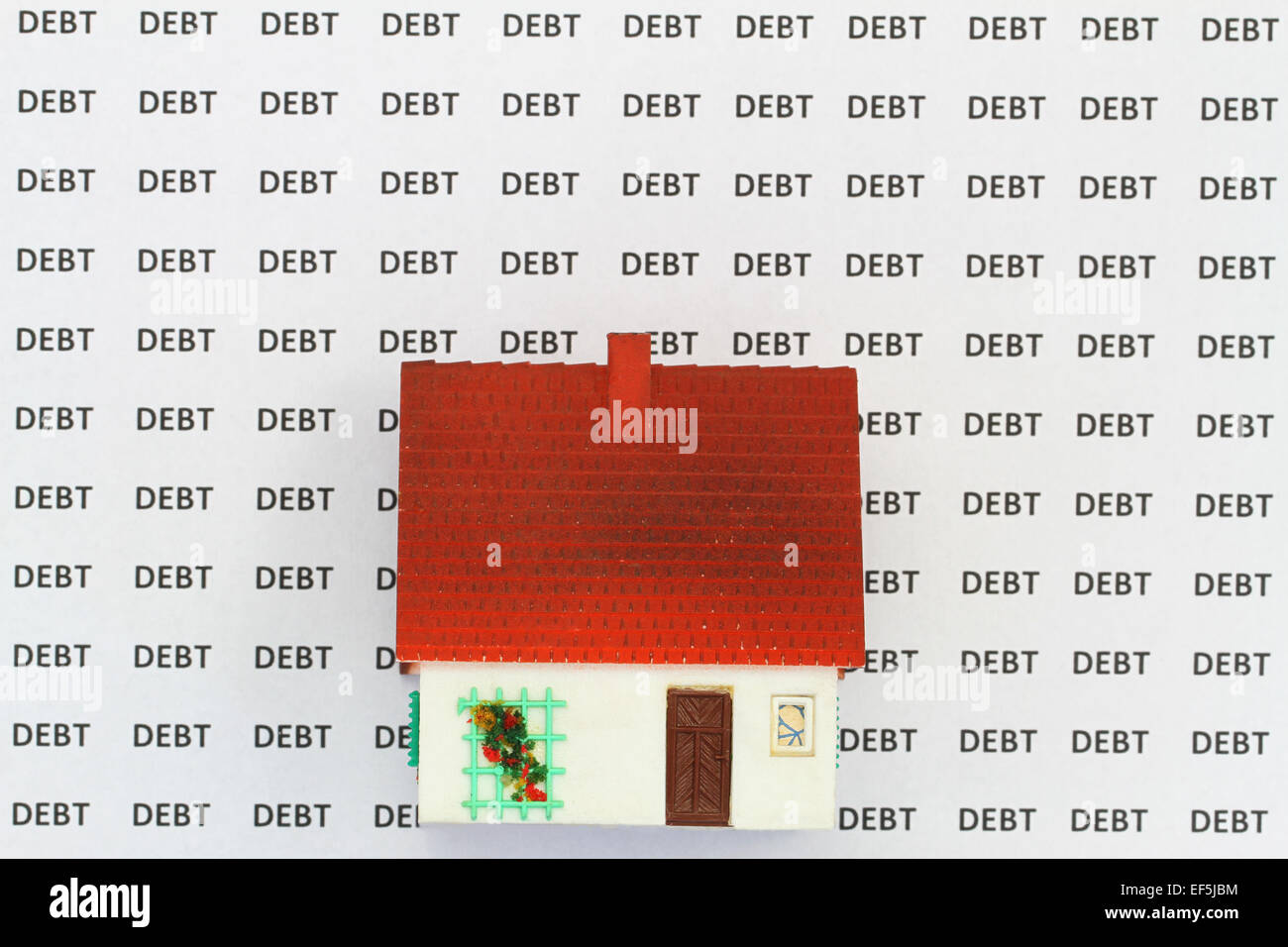 Haus am Hintergrund mit Worten Schulden Stockfoto