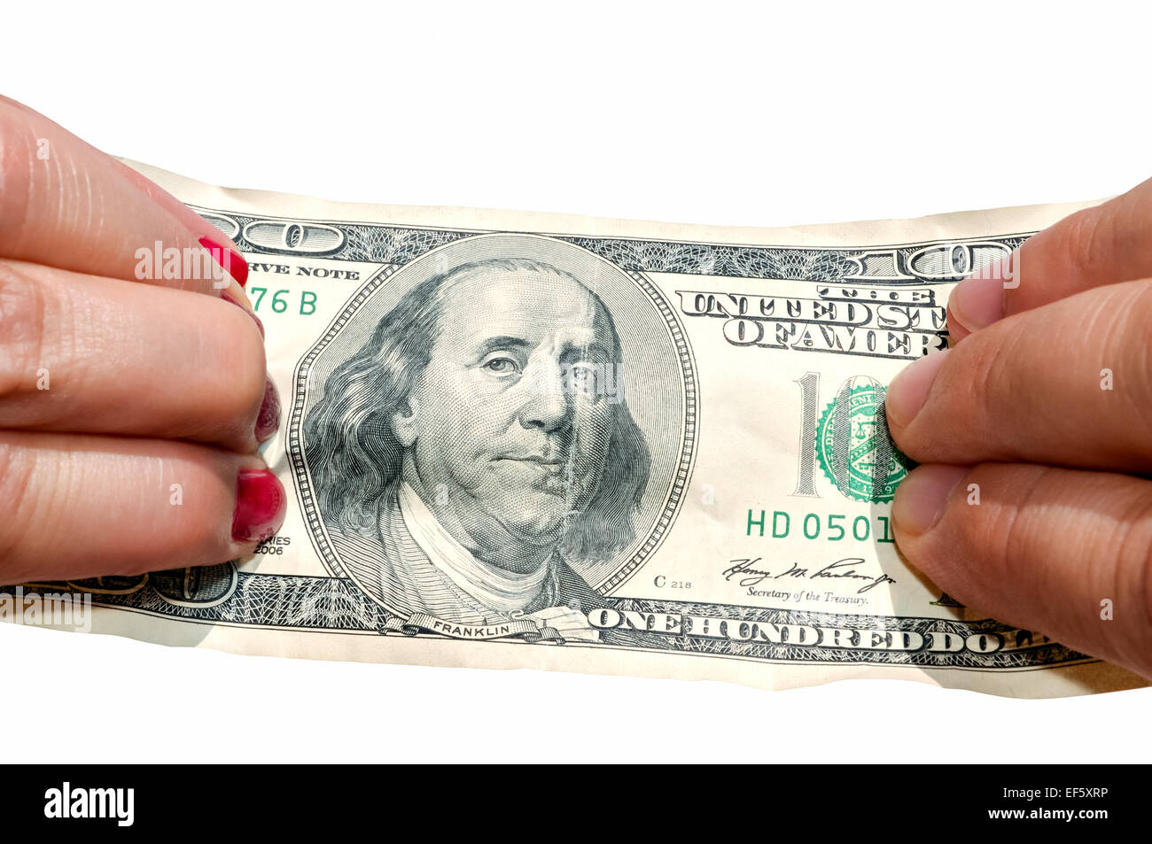Zwei Hände dehnen Banknote isoliert auf weißem Hintergrund Stockfoto