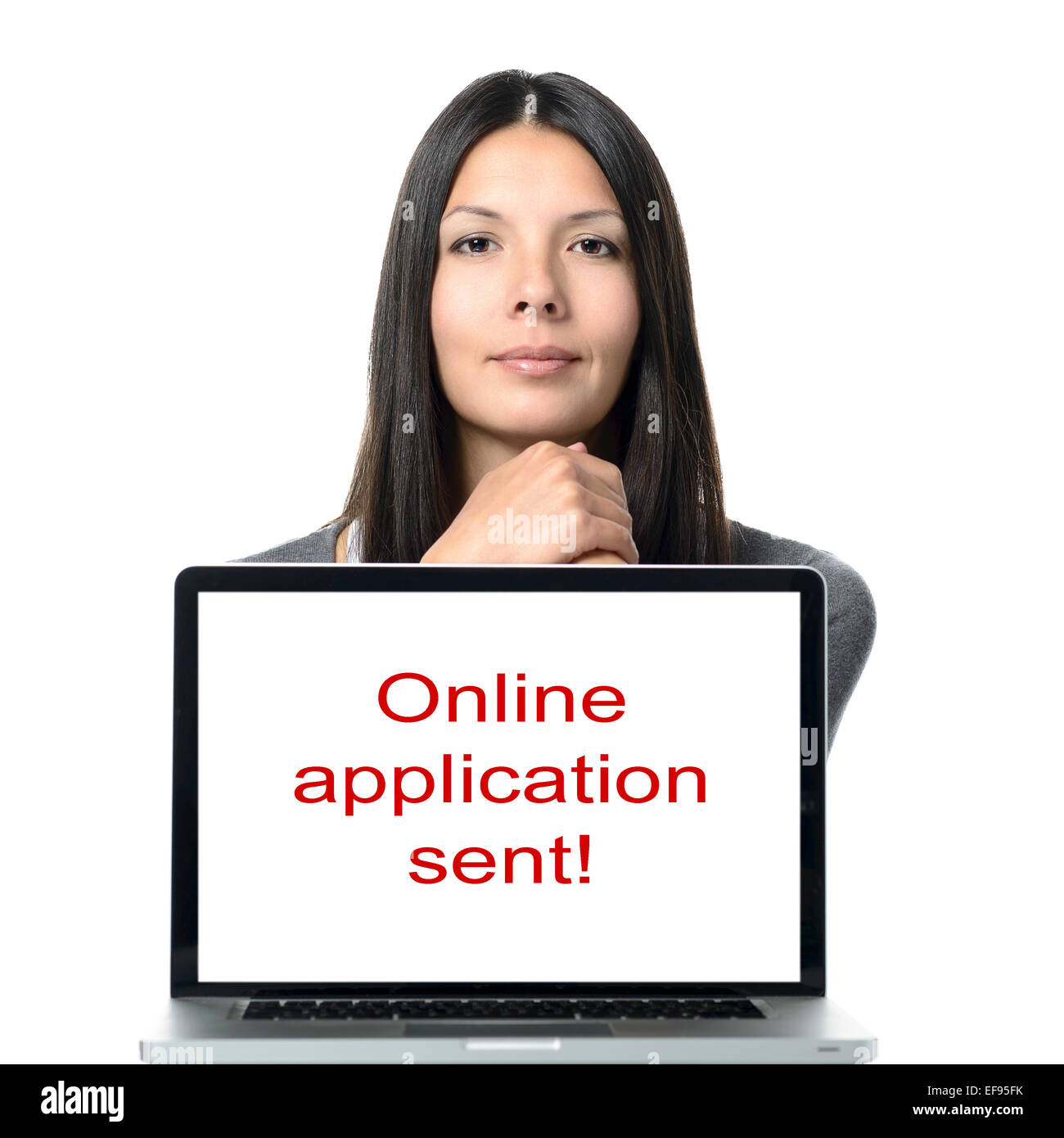 Online-Anwendung gesendet Konzept - Nahaufnahme lächelnde Frau hinter Computer Bildschirm während in die Kamera schaut. Isolated on White Stockfoto