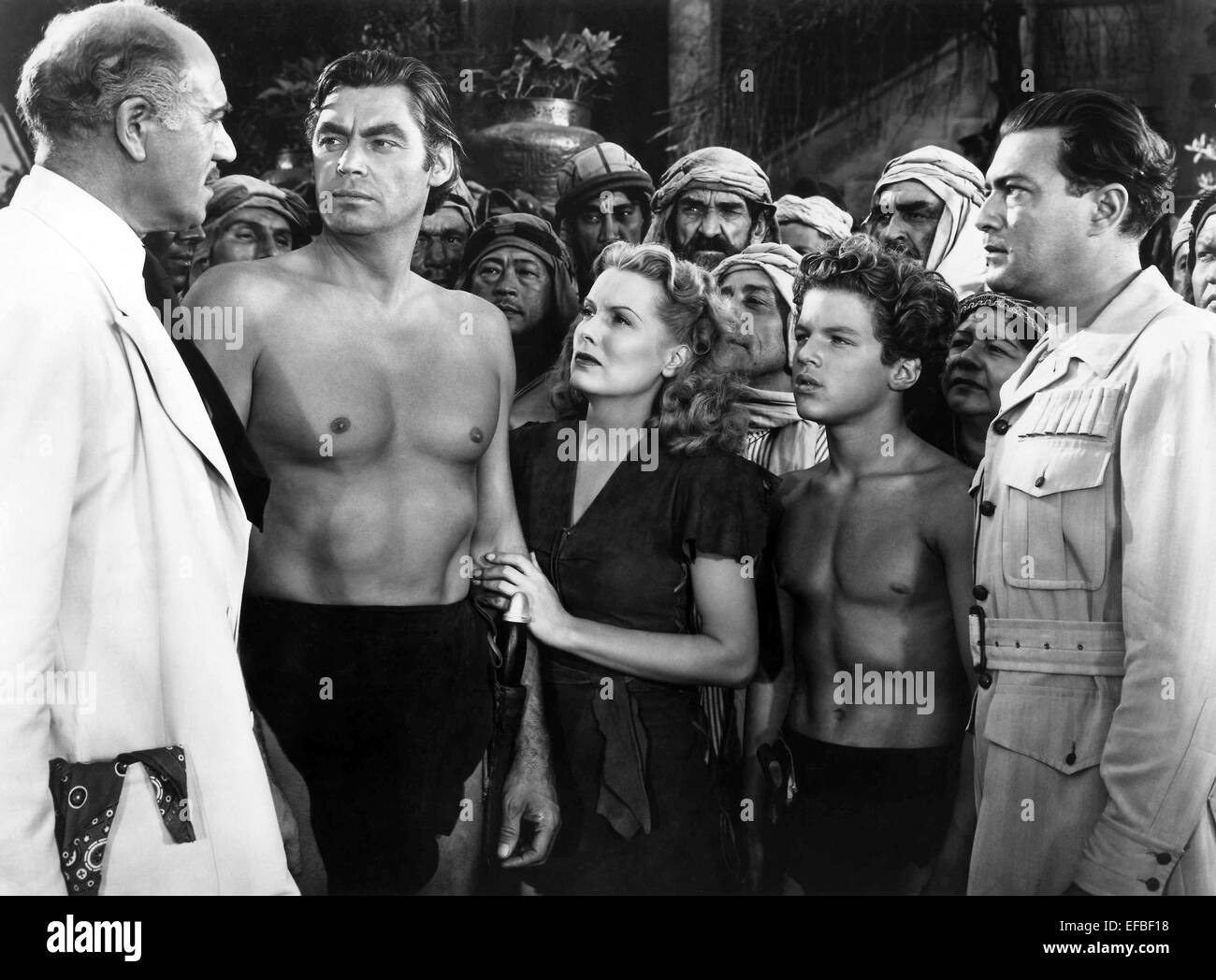 DENNIS HOEY, Johnny Weissmuller, BRENDA JOYCE, JOHNNY SHEFFIELD, EDGAR BARRIER, TARZAN UND DER LEOPARD FRAU, 1946 Stockfoto