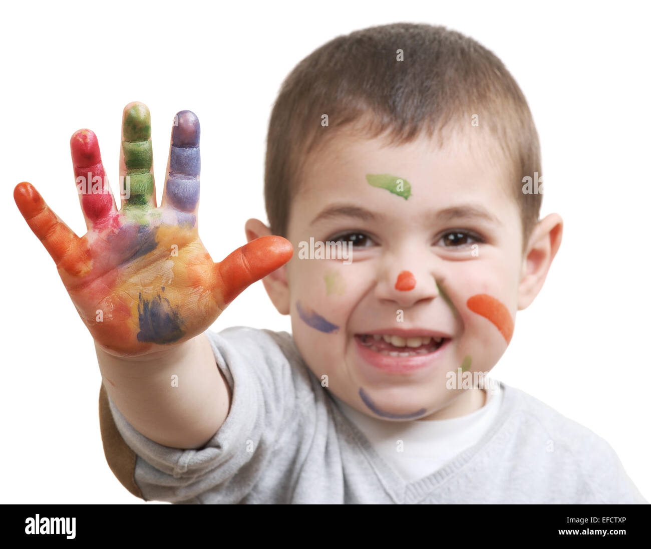 glücklich kleiner Junge mit Lacken auf Händen isoliert auf weißem Hintergrund Stockfoto