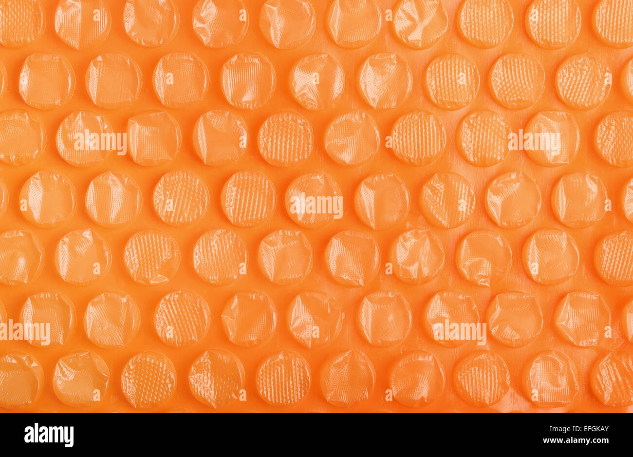 Orange Kunststoff Bubble Wrap Hintergrund Stockfoto