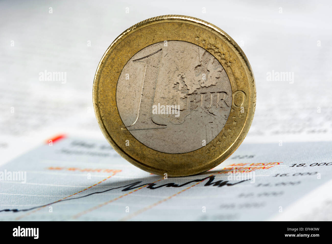 Ein-Euro-Münze auf schwankende graph Stockfoto