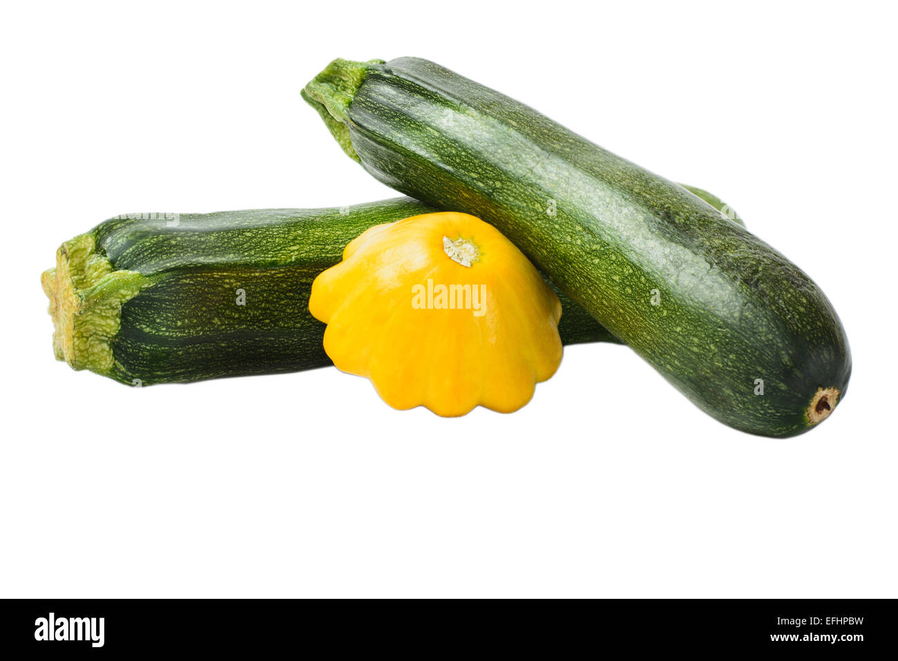 Grüne und gelbe Kürbis und Zucchini auf weißem Hintergrund Stockfoto
