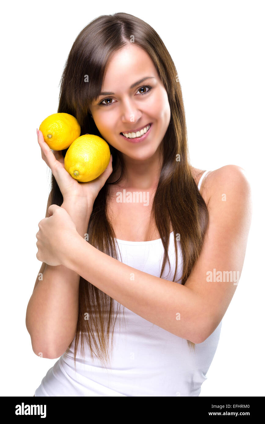 Gesunde Lebensweise - schöne hübsche Frau hält zwei Zitronen Stockfoto