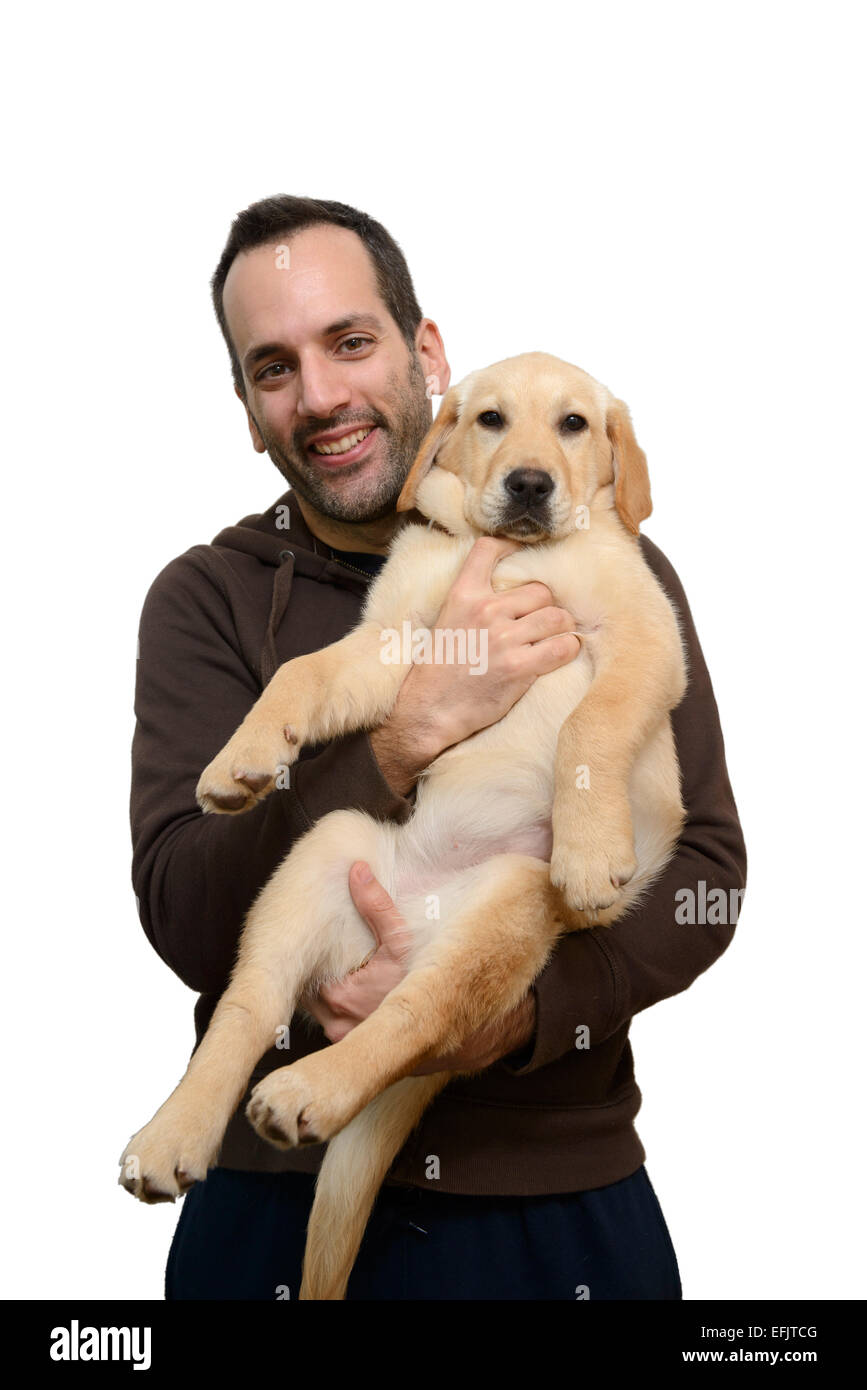 Mann mit gelber Labrador Golden Retriever Mix Welpen Stockfotografie Alamy