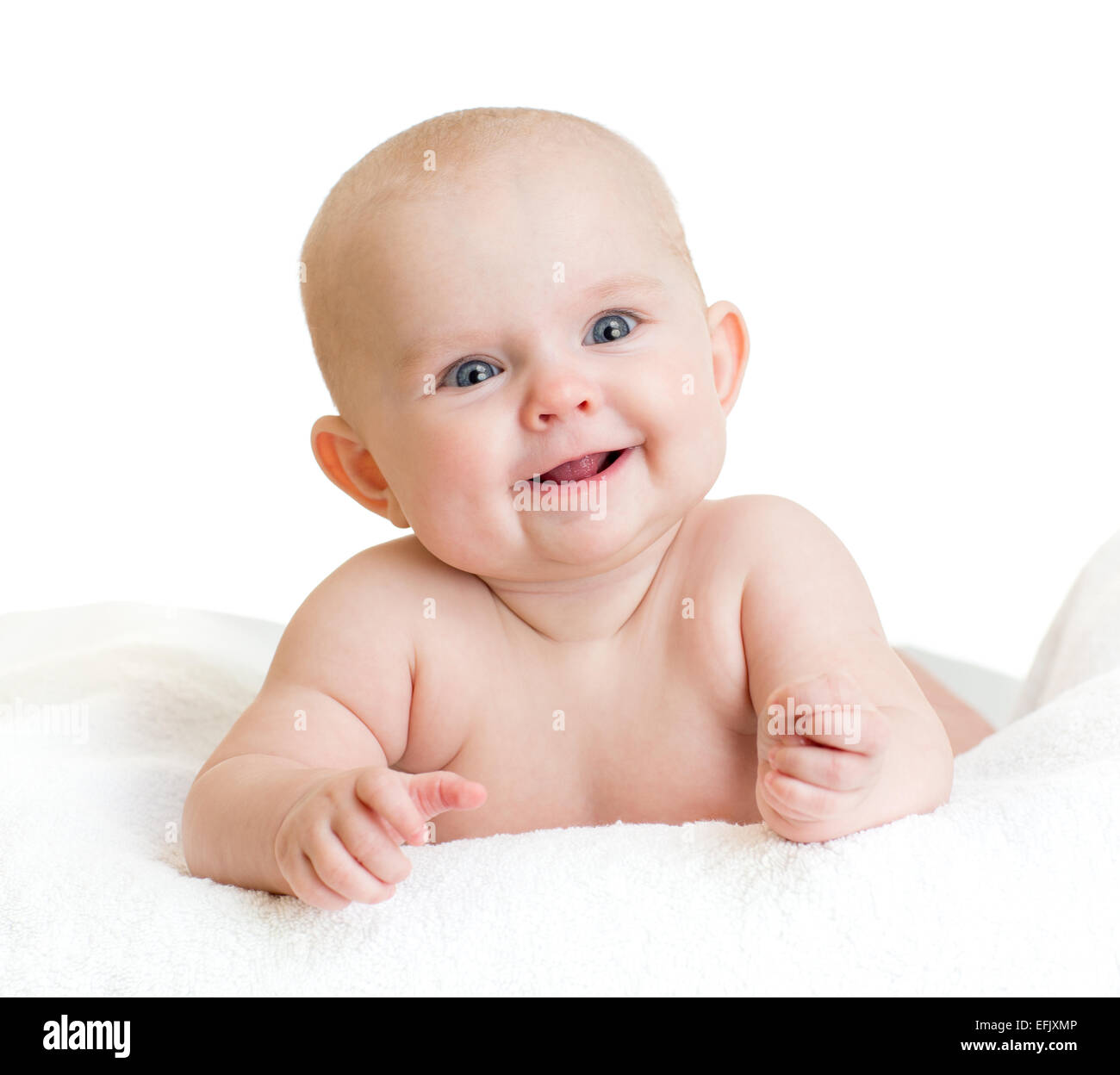Süßes Lächeln auf den Lippen Baby Kind liegend Stockfoto