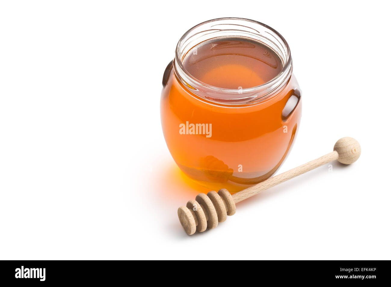 Honig in einem Glas auf weißem Hintergrund Stockfoto