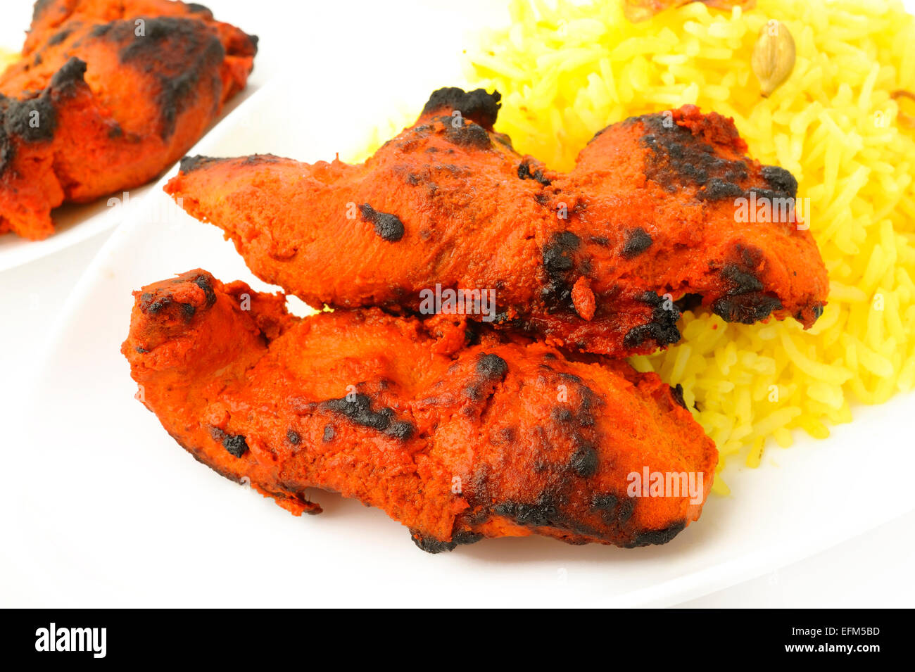 Tandoori Chicken Tikka mit Pilau Reis Stockfoto