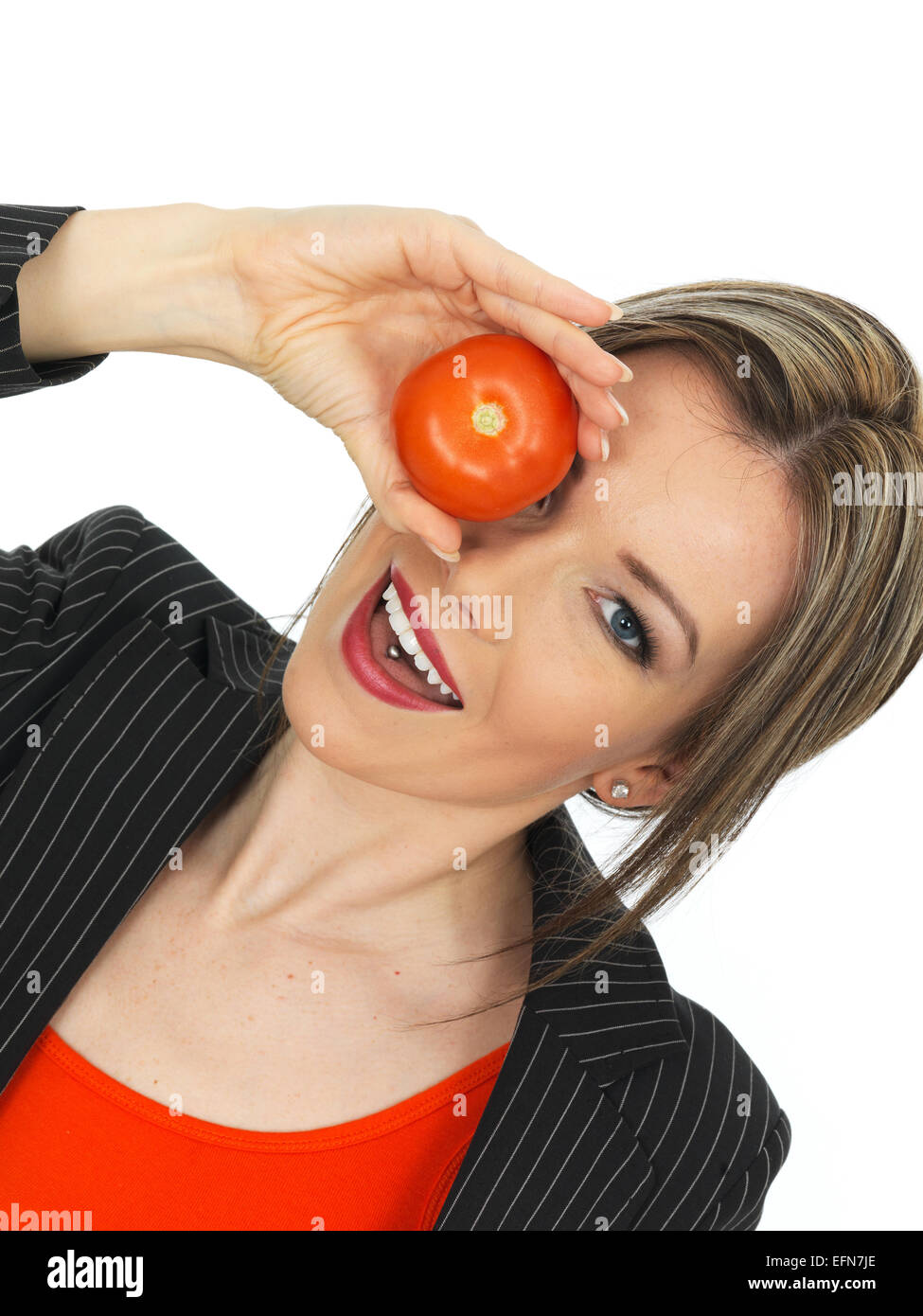 Junge, Gesunde und Business Woman Holding eine rohe Tomaten Stockfoto