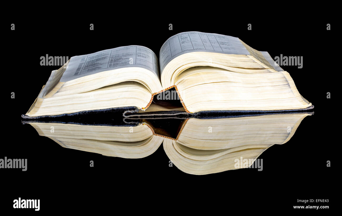 Altes Buch offen mit Reflexion Stockfoto