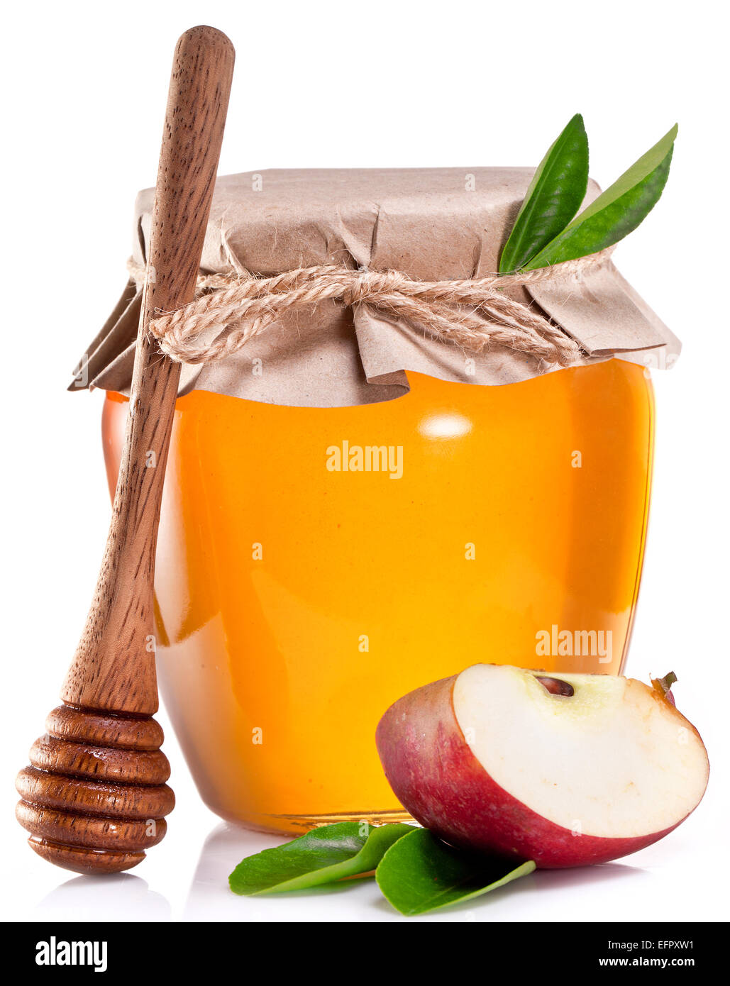 Glas kann der Honig, die Hälfte von Apple und Holzstab auf alten Holztisch voll. Stockfoto