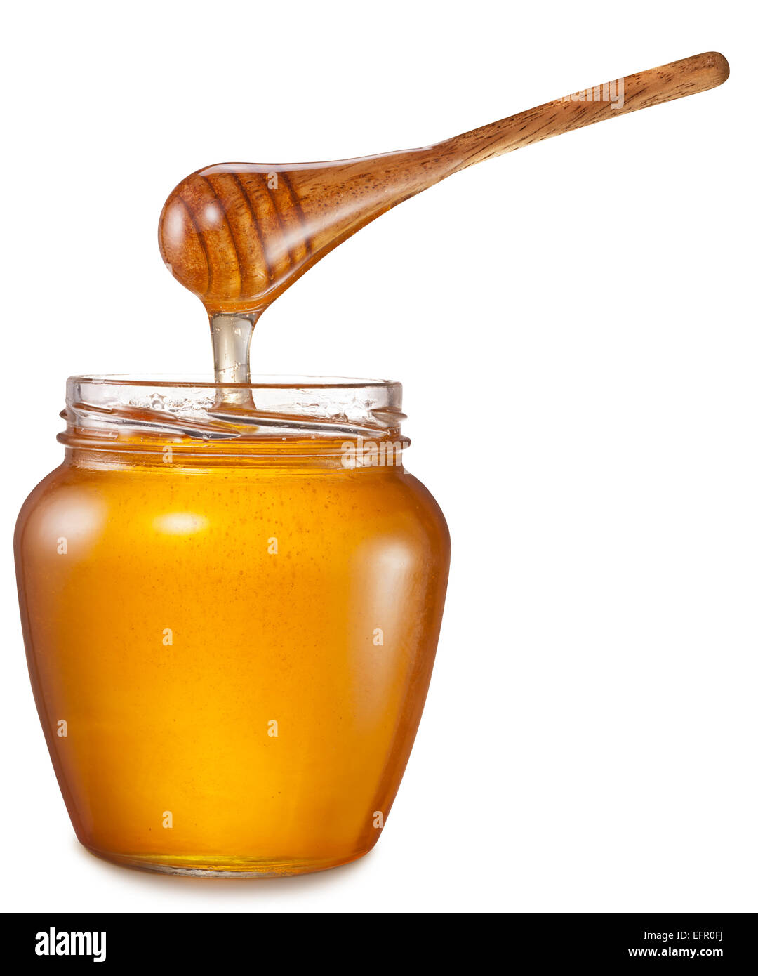 Honig fließt in Glas. Datei enthält Beschneidungspfade. Stockfoto
