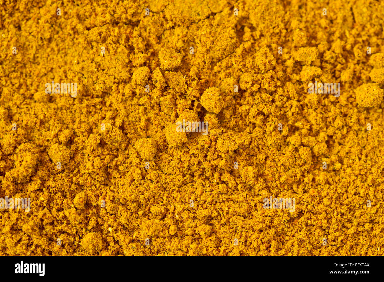 Eine Makroaufnahme einer Curry-Pulver. Kann als Hintergrund verwendet werden. Stockfoto
