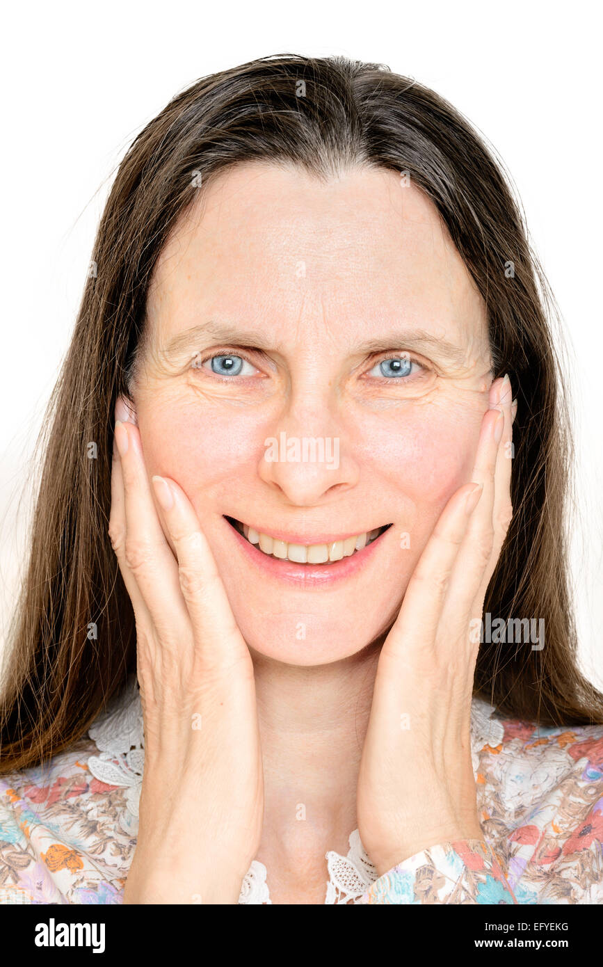 Porträt einer glücklich lächelnd Reife Frau, mit den Händen im Gesicht Stockfoto
