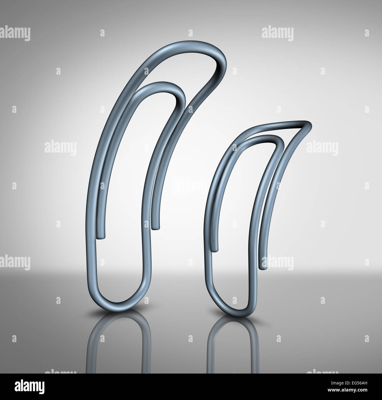 Büro zu Mobbing und Mobber in die Arbeitsplatzkonzept als zwei Büroklammern mit eine einschüchternde ein anderes als ein corporate Bully Metapher und Arbeitskraft Management. Stockfoto