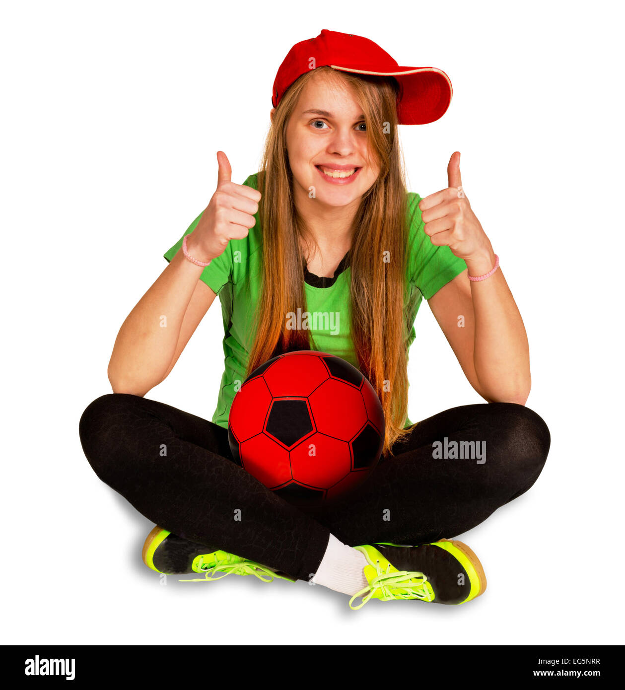 Mädchen sitzen mit Ball auf dem weißen Hintergrund Stockfoto