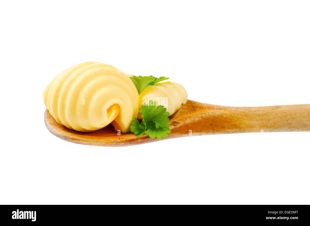 Butter locken auf Holzlöffel Stockfoto