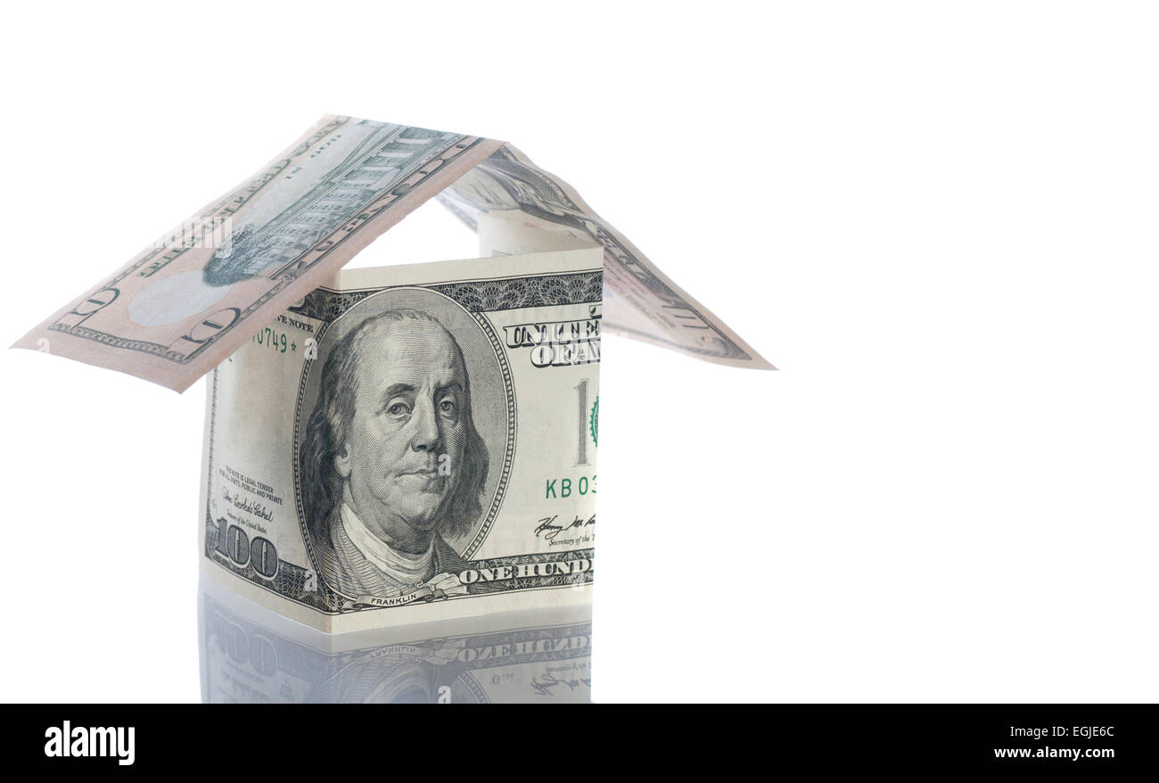 Dollar und Pfund Häuser isoliert auf weiß. Stockfoto