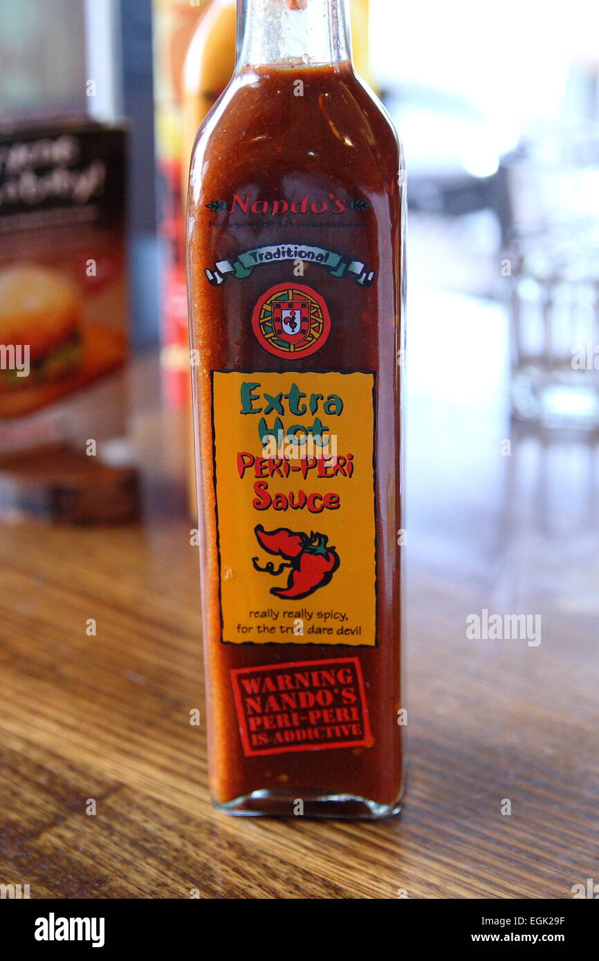 Nandos Extra heiß Peri-Peri Sauce Stockfoto