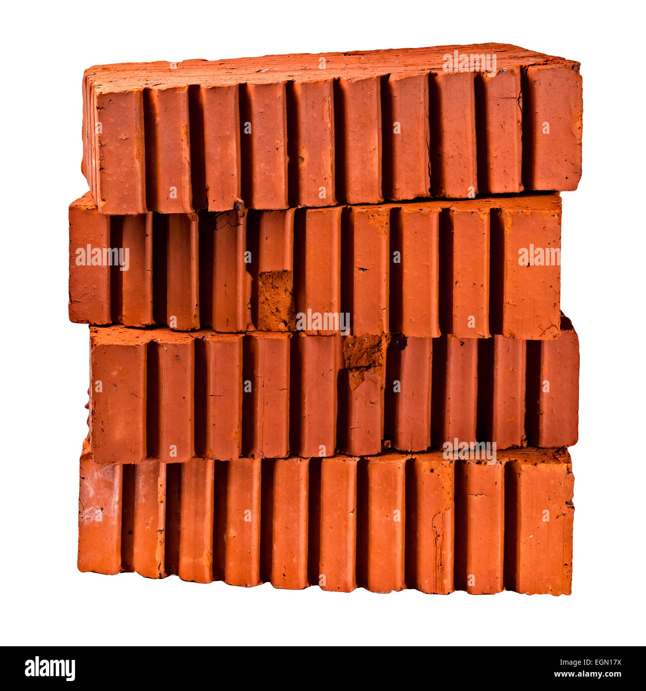 Stapel von vier Bau-, Baustoff-, gemeinsame, strukturelle Ziegel der orange Farbe auf weißen Hintergrund isoliert. Stockfoto