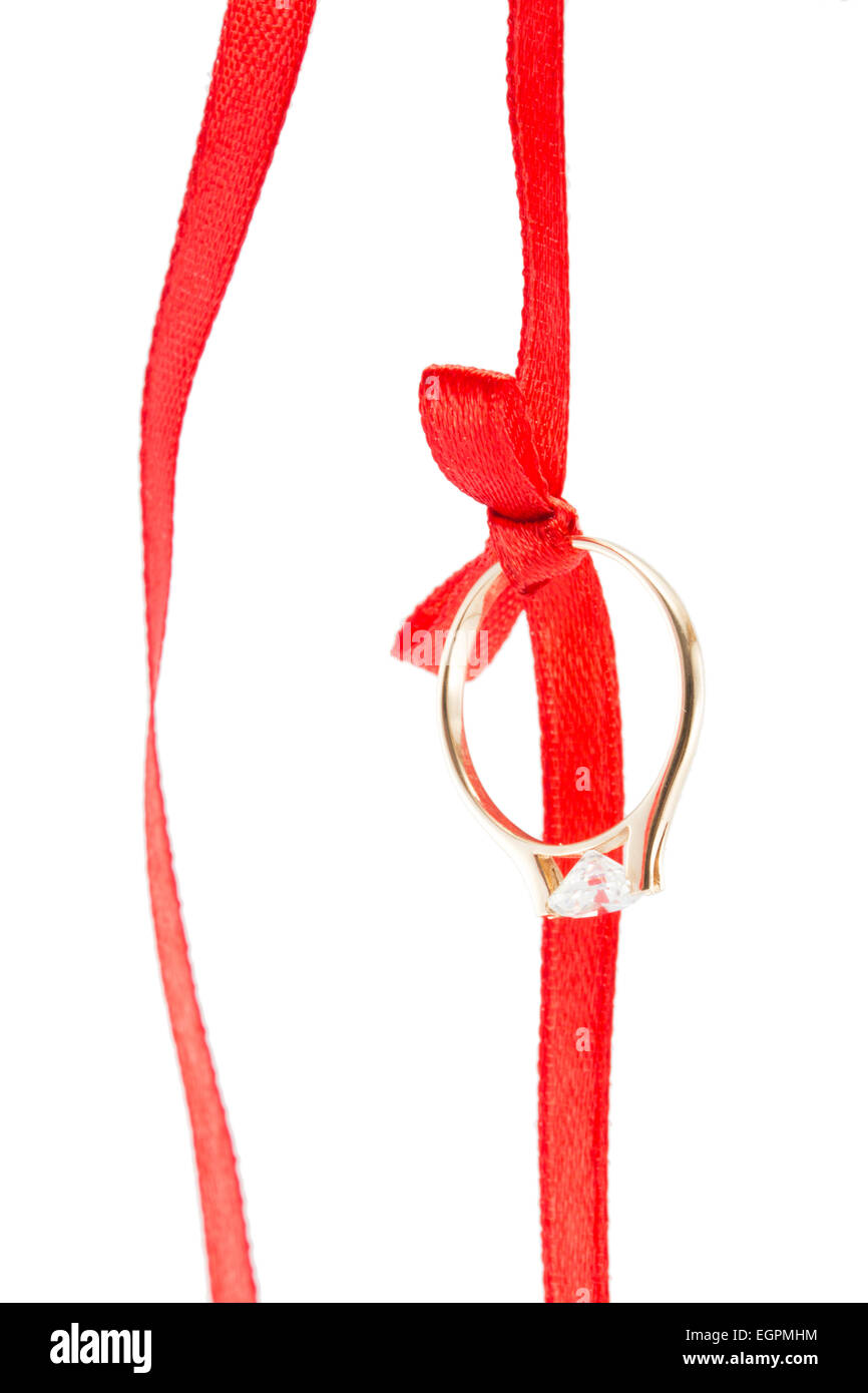 Goldring und ein rotes Band mit Schleife Stockfoto