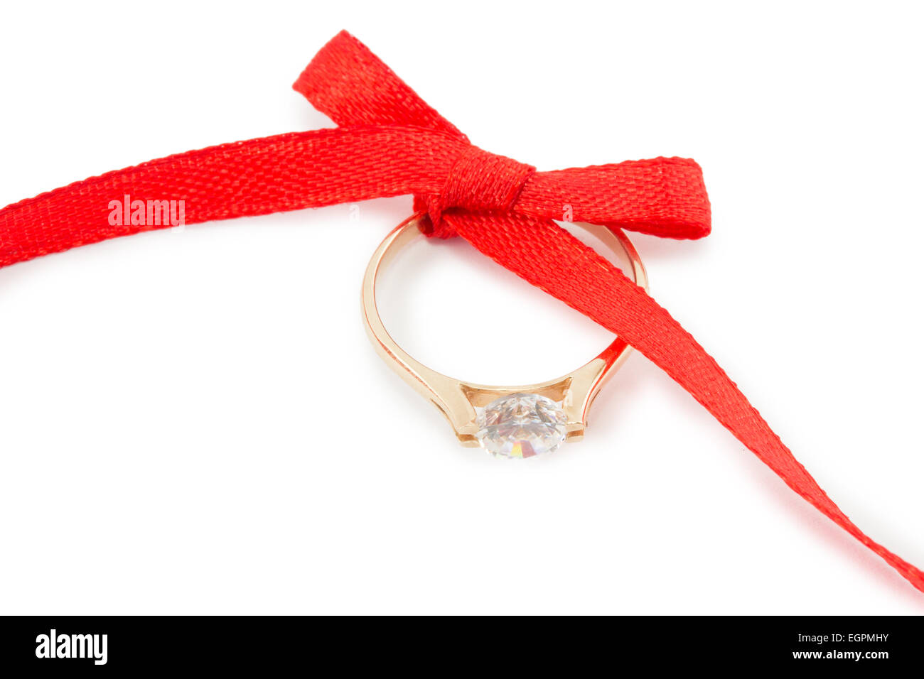 Goldring und ein rotes Band mit Schleife Stockfoto