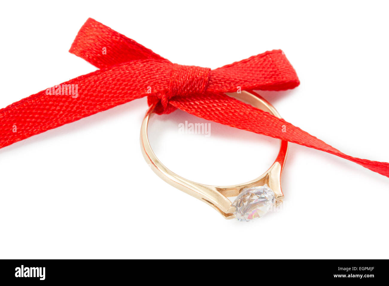 Goldring und ein rotes Band mit Schleife Stockfoto