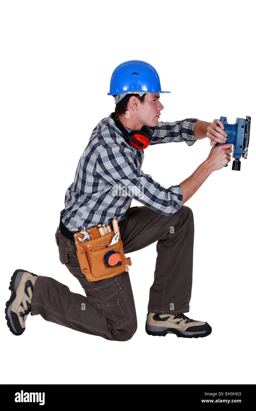 Handwerker mit einem sander Stockfoto