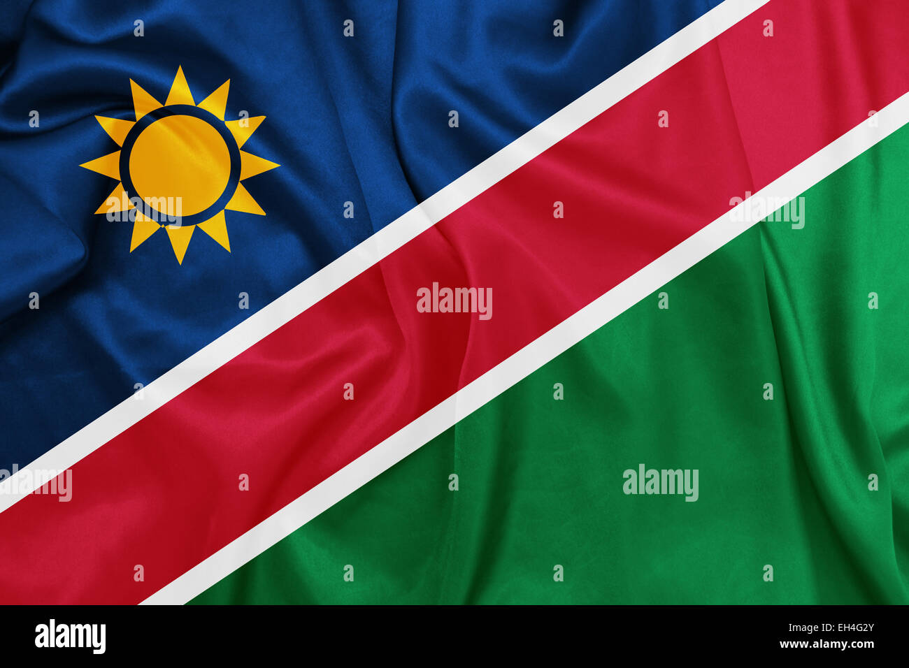 Namibia - winken Nationalflagge auf Seide Textur Stockfoto