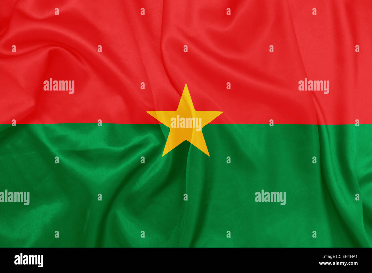 Burkina Faso - winken Nationalflagge auf Seide Textur Stockfoto