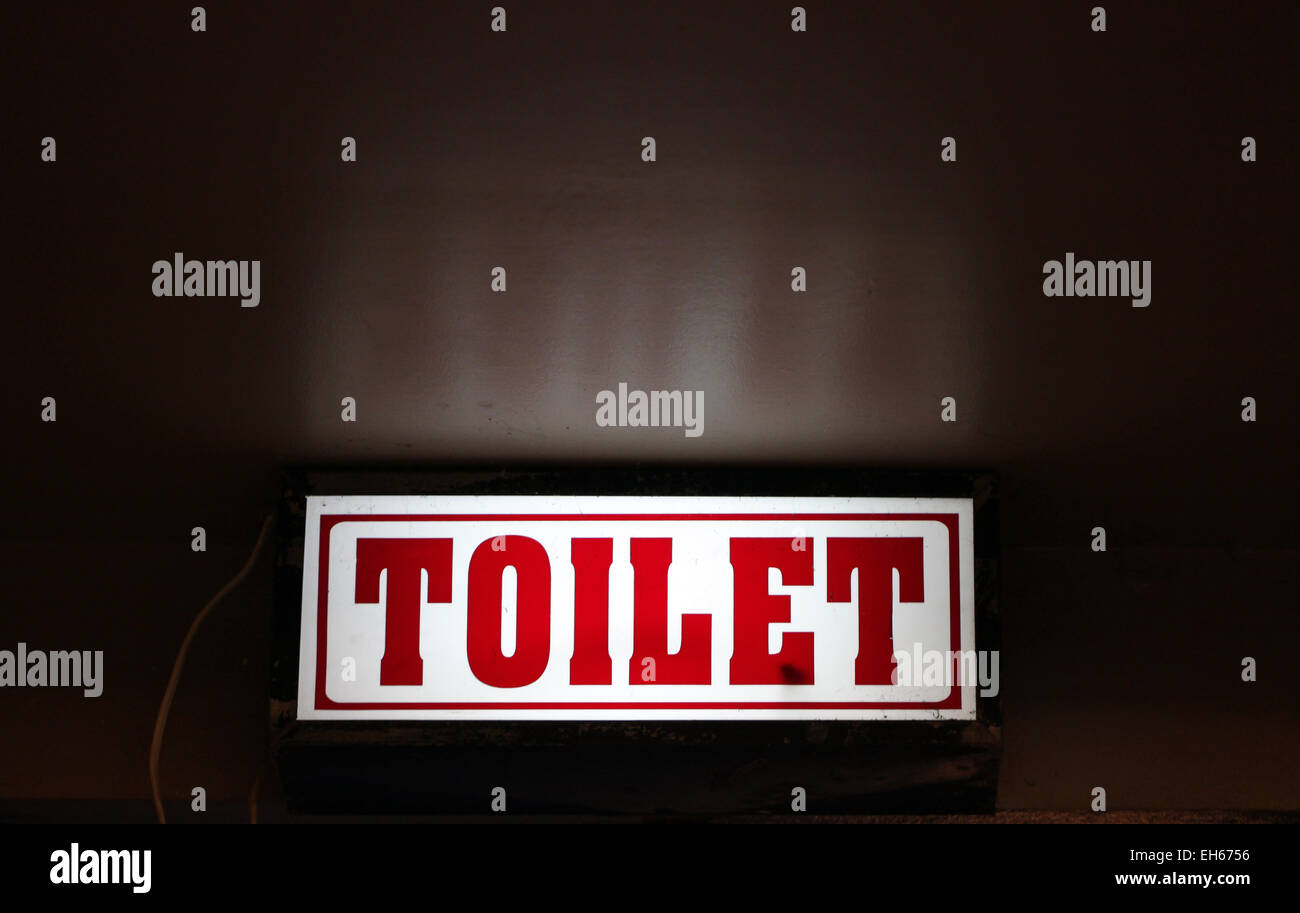 LED-Schilder bieten direktionale auf die Toilette. Stockfoto