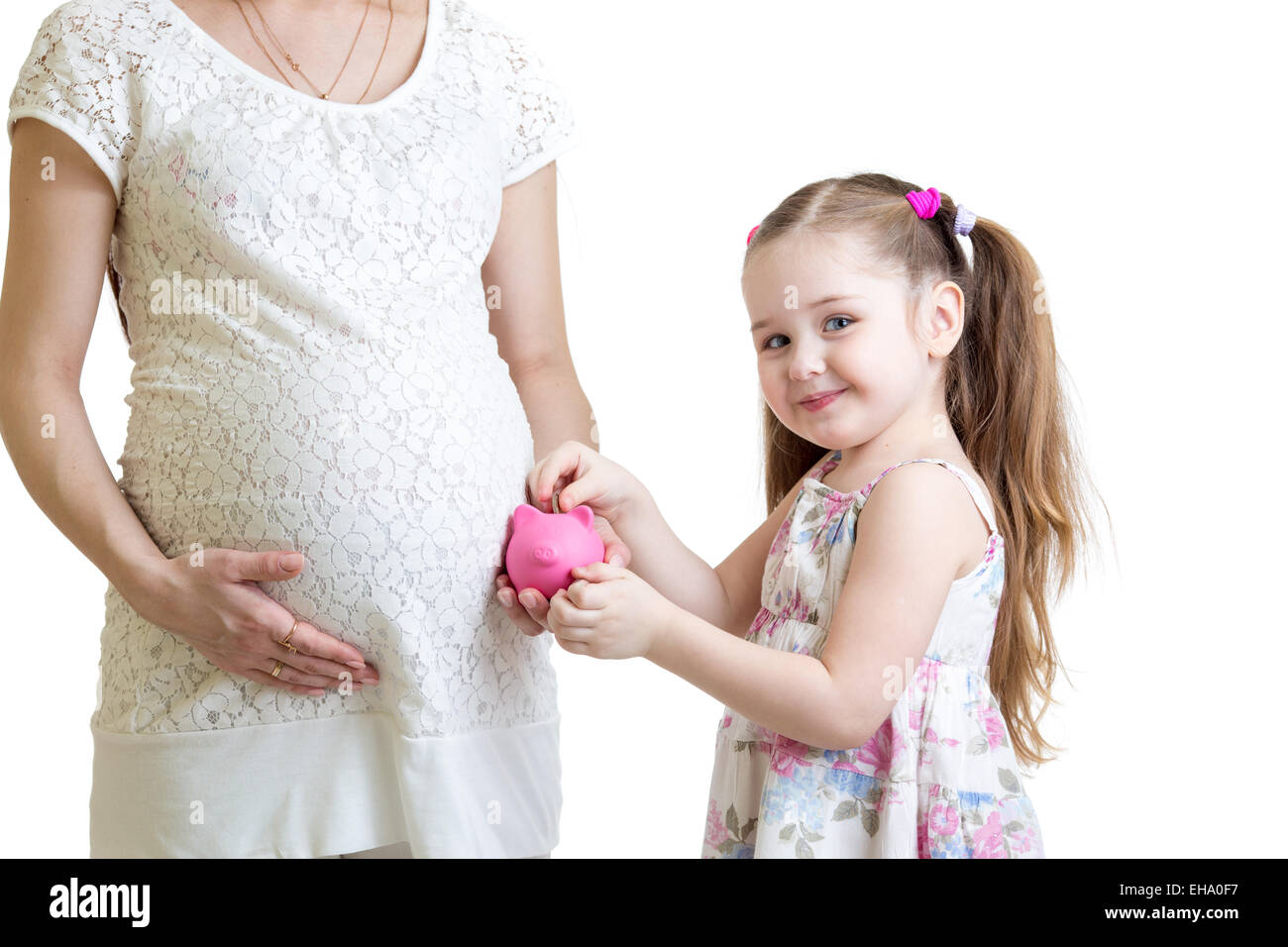 Schwangere Mutter und Kind Sparschwein Münzen Inbetriebnahme Stockfoto